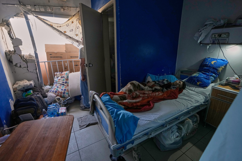 A sick boy lies in a damaged room in the Jabal Amel Hospital, following Monday's Israeli airstrike that hit a nearby building, in the southern port city of Tyre, Lebanon, Tuesday, June 2, 2026. (AP Photo/Mohammed Zaatari)