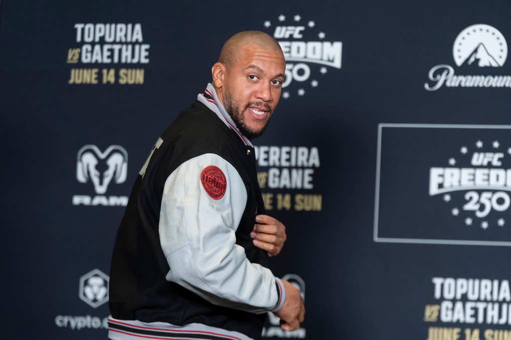 UFC heavyweight fighter Cyril Gane of Franceshows a patch on the sleeve of his jacket during the UFC Freedom 250 media day, Wednesday, June 10, 2026, in Washington. (AP Photo/Manuel Balce Ceneta)