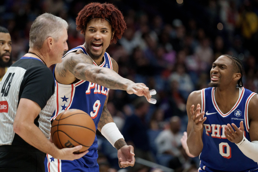 Philadelphia 76ers guard Kelly Oubre Jr. (9) and guard Tyrese Maxey (0) argue a call during the first half of an NBA basketball game against the New Orleans Pelicans in New Orleans, Saturday, Feb. 21, 2026. (AP Photo/Matthew Hinton)