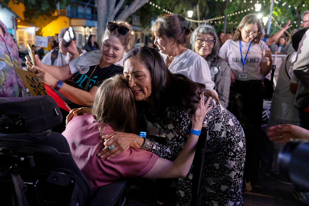 Democratic gubernatorial candidate Deb Haaland hugs and greets supporters following her speech during a primary election night watch party after winning the Democratic nomination, Tuesday, June 2, 2026, in Albuquerque, New Mexico. (AP Photo/Jon Austria)