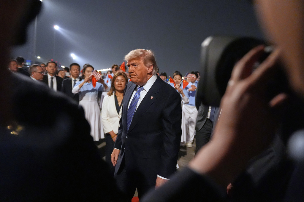President Donald Trump walks during an arrival ceremony Wednesday, May 13, 2026, at Beijing Capital International Airport in Beijing. (AP Photo/Mark Schiefelbein)