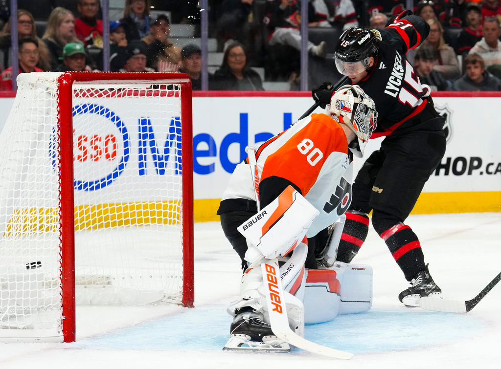 Ottawa Senators' Olle Lycksell (15) scores on Philadelphia Flyers goaltender Dan Vladar (80) during second period NHL hockey action in Ottawa on Thursday, Oct. 23, 2025. (Sean Kilpatrick/The Canadian Press via AP)