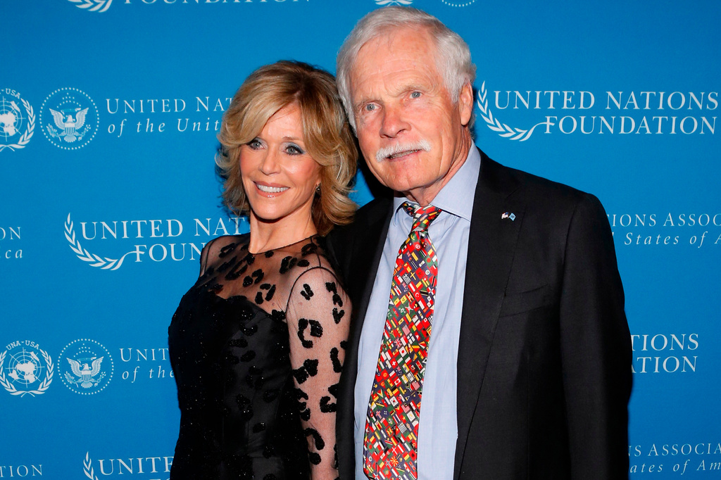 FILE - Actress Jane Fonda and CNN founder Ted Turner pose together at the United Nations Foundation Global Leadership Dinner, Nov. 6, 2013, in New York. (AP Photo/Jason DeCrow, File)