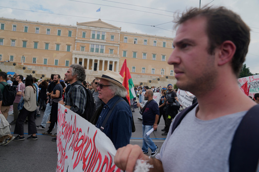 Protesters take part in a nationwide 24-hour strike in Athens, Greece, Tuesday, Oct. 14, 2025, as labor unions demand higher wages and the withdrawal of a bill changing work hours. (AP Photo/Petros Giannakouris) Protesters take part in a nationwide 24-hour strike in Athens, Greece, Tuesday, Oct. 14, 2025, as labor unions demand higher wages and the withdrawal of a bill changing work hours. (AP Photo/Petros Giannakouris)
