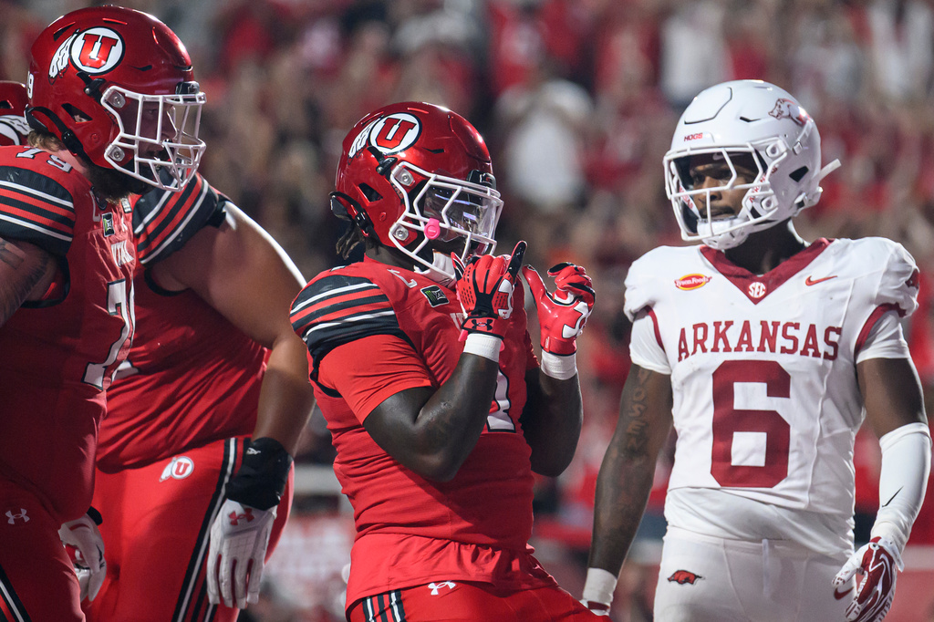Utah running back Wayshawn Parker (1) celebrates scoring a touchdown during the first half of an NCAA college football game against Arkansas, Saturday, Sept. 12, 2026, in Salt Lake City. (AP Photo/Tyler Tate)