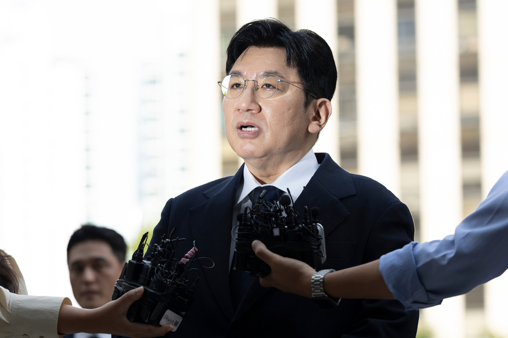 FILE - Bang Si-Hyuk, a chairman of Hybe, answers reporters' question upon his arrival at the Seoul Metropolitan Police Agency in Seoul, South Korea, on Sept. 15, 2025. (Kim Keun-soo/Newsis via AP, File)