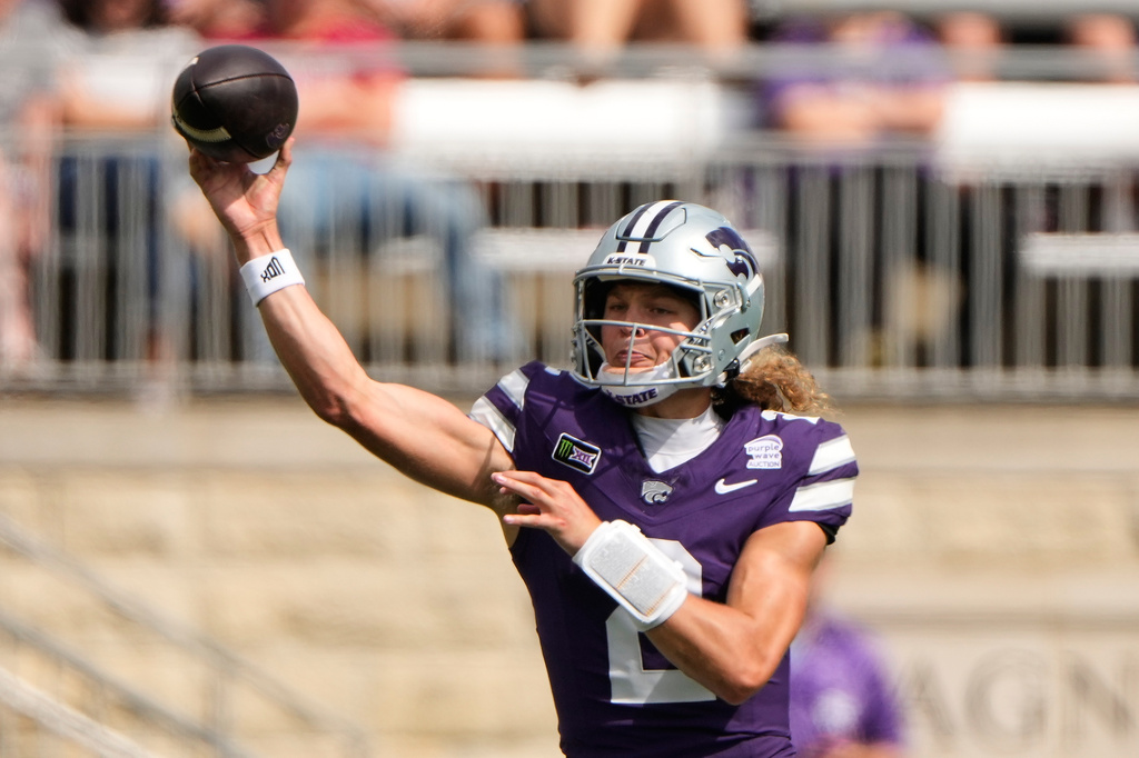 Kansas State quarterback Avery Johnson throws during the first half of an NCAA college football game against Washington State Saturday, Sept. 12, 2026, in Manhattan, Kan. (AP Photo/Charlie Riedel)