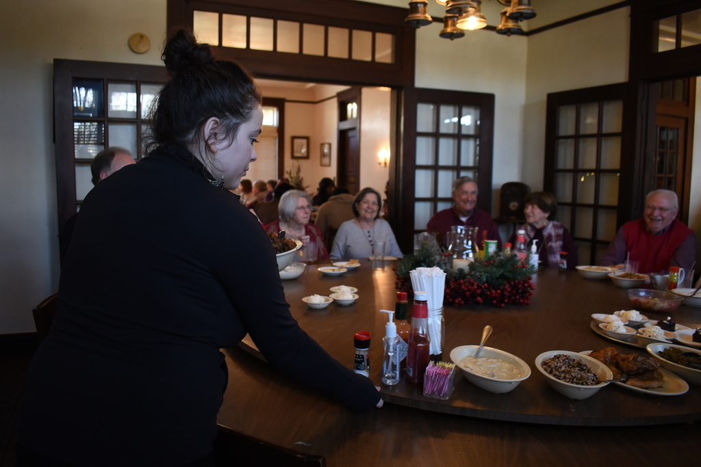 Lilli Johnson, a server at The Dinner Bell rotates a lazy Susan on Thursday, Dec. 11, 2025 in McComb, Miss. (AP Photo/Sophie Bates)