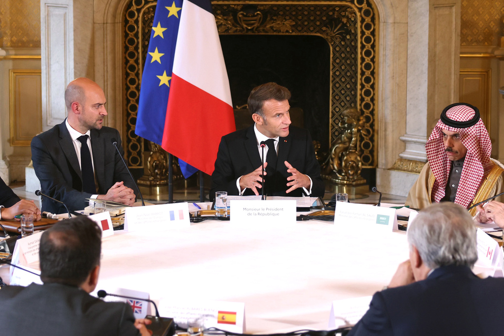 France's President Emmanuel Macron flanked by France's outgoing Minister of Foreign Affairs Jean-Noel Barrot, left, and Saudi Arabia Foreign Minister Faisal bin Farhan Al-Saud, speaks during the meeting on Mideast talks with European and Arab foreign ministers at the foreign ministry in Paris, Thursday Oct. 9, 2025. (Thomas Samson/Pool Photo via AP)