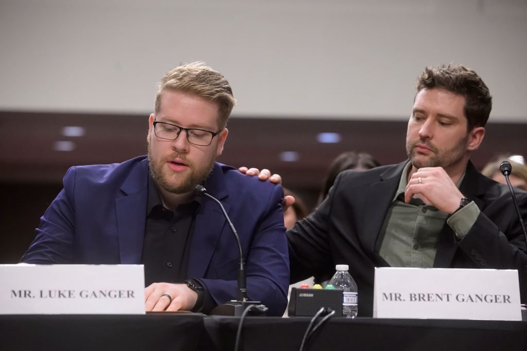 Luke Ganger, left, and Brent Ganger, right, brothers of Renee Good, appear during a Bicameral Public Forum on the Disproportionate Use of Force by DHS Agents, on Capitol Hill, Tuesday, Feb. 3, 2026, in Washington. (AP Photo/Rod Lamkey, Jr.)
