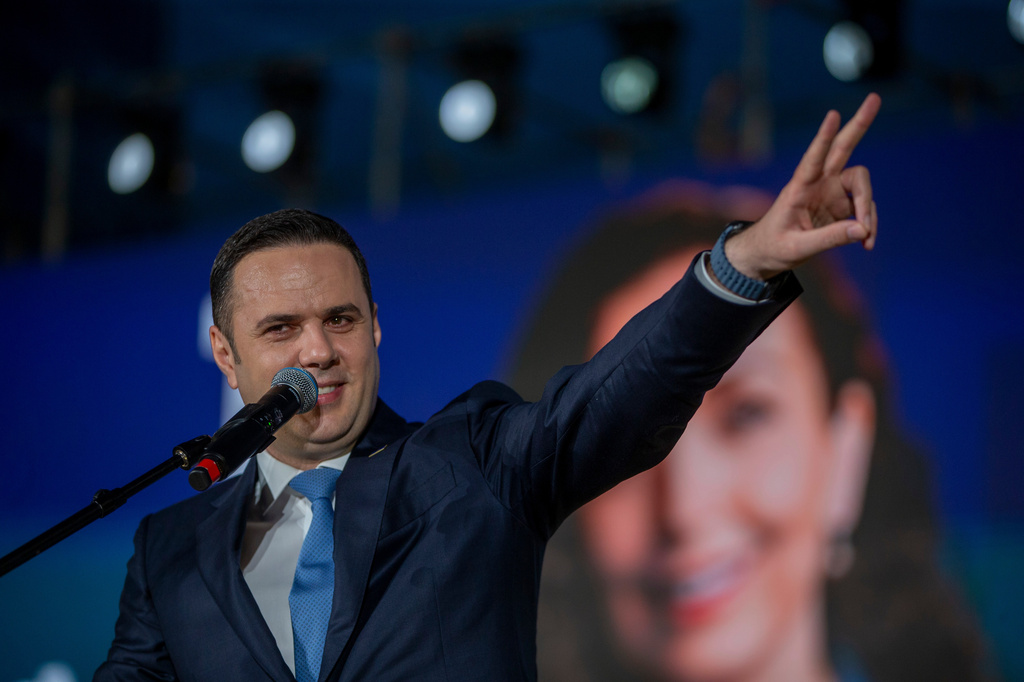 Lumir Abdixhiku, opposition leader, flashes victory sign at the closing political rally of the Democratic League of Kosovo (LDK), in capital Pristina on Friday, June 5, 2026. (AP Photo/Visar Kryeziu)