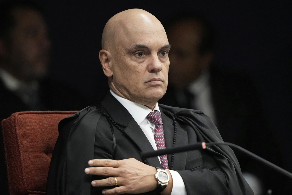 Supreme Court Justice Alexandre de Moraes attends the verdict and sentencing phase of a trial for those charged in an alleged coup plot to keep Brazil's former President Jair Bolsonaro in office after his 2022 election defeat, in Brasilia, Brazil, Thursday, Sept. 11, 2025. (AP Photo/Eraldo Peres)