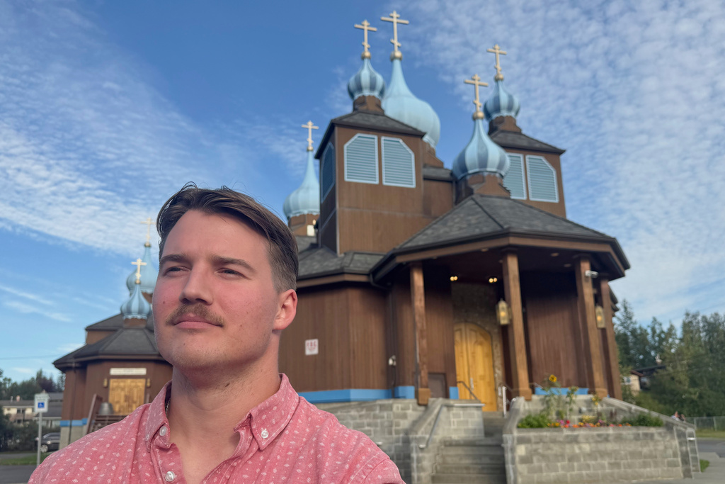 Mark Kalashnikov, a native of Russia living in the United States, poses for a photo outside St. Innocent Orthodox Cathedral on Aug. 12, 2025, in Anchorage, Alaska. (AP Photo/Mark Thiessen)