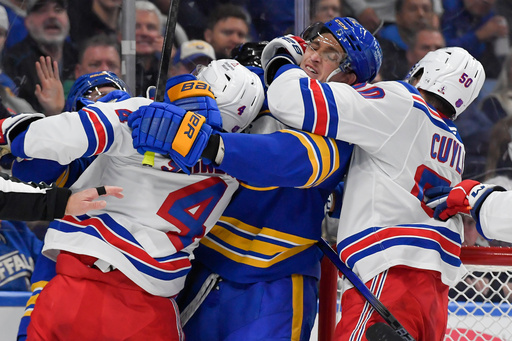Buffalo Sabres center Tage Thompson, second from right, is held by New York Rangers left wing Will Cuylle (50) as players scuffle after the whistle during the second period of an NHL hockey game in Buffalo, N.Y., Thursday, Oct. 9, 2025. (AP Photo/Adrian Kraus) Buffalo Sabres center Tage Thompson, second from right, is held by New York Rangers left wing Will Cuylle (50) as players scuffle after the whistle during the second period of an NHL hockey game in Buffalo, N.Y., Thursday, Oct. 9, 2025. (AP Photo/Adrian Kraus)