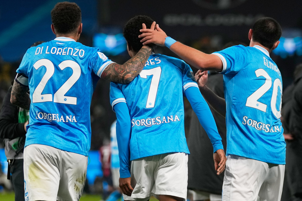 Napoli's David Neres, center, celebrates with teammates after scoring during the Italian Super Cup final soccer match between Napoli and Bologna in Riyadh, Saudi Arabia, Monday, Dec. 22, 2025. (AP Photo/Altaf Qadri