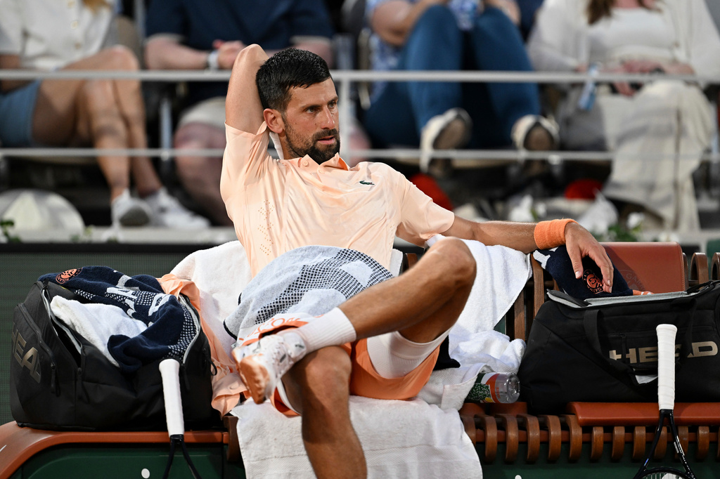 Novak Djokovic of Serbia looks on during a break of the first round men's singles tennis match against Giovanni Mpetshi Perricard of France at the French Open tennis tournament in Paris, Sunday, May 24, 2026. (AP Photo/Emma Da Silva)