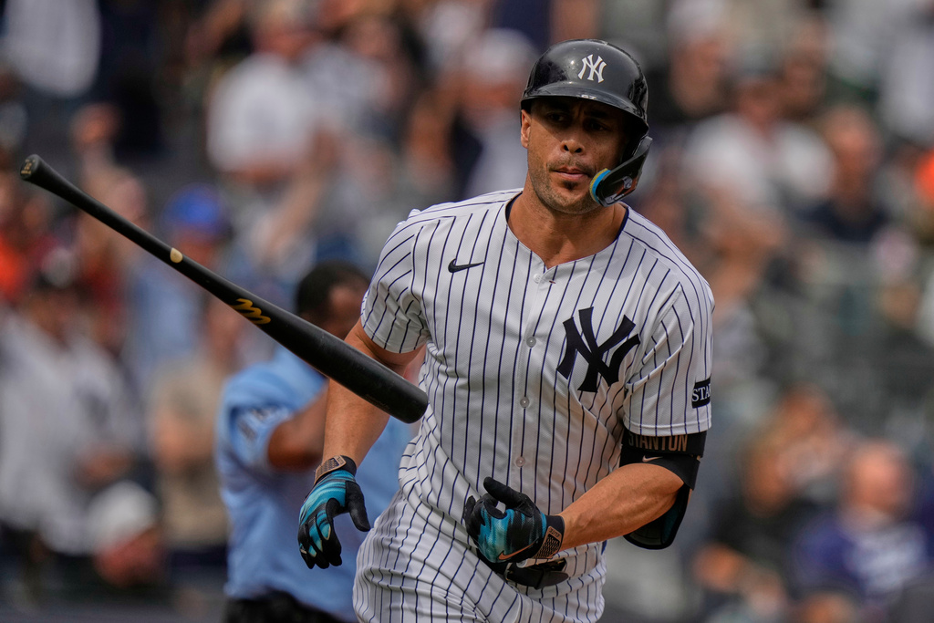 New York Yankees' Giancarlo Stanton tosses his bat after hitting a home run during the second inning of a baseball game against the Baltimore Orioles Saturday, Sept. 27, 2025, in New York. (AP Photo/Frank Franklin II)