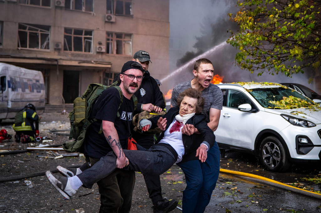 People carry an injured woman into an ambulance after a Russian drone strike in Kyiv, Ukraine, Monday, Sept. 28, 2026. (AP Photo/Dan Bashakov)
