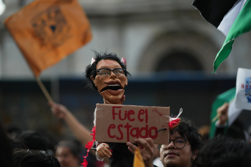A protester holds a doll representing former President Gustavo Diaz Ordaz during a protest commemorating the anniversary of the 1968 Tlatelolco killings, when soldiers fired on student protesters, in Mexico City, Thursday, Oct. 2, 2025. (AP Photo/Eduardo Verdugo) A protester holds a doll representing former President Gustavo Diaz Ordaz during a protest commemorating the anniversary of the 1968 Tlatelolco killings, when soldiers fired on student protesters, in Mexico City, Thursday, Oct. 2, 2025. (AP Photo/Eduardo Verdugo)