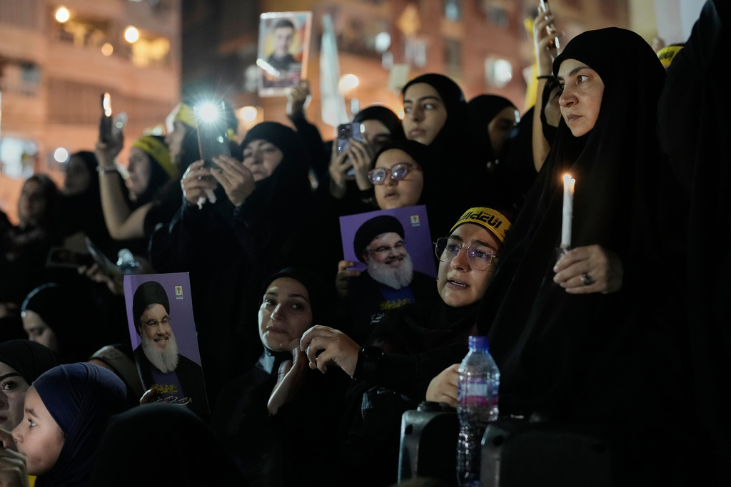 People gather at the site where Hezbollah leader Hassan Nasrallah was killed in Israeli airstrikes on Sept. 27, 2024, a day before the first anniversary of his death, in the Haret Hreik suburb south of Beirut, Lebanon, Friday, April 26, 2025. (AP Photo/Hassan Ammar)