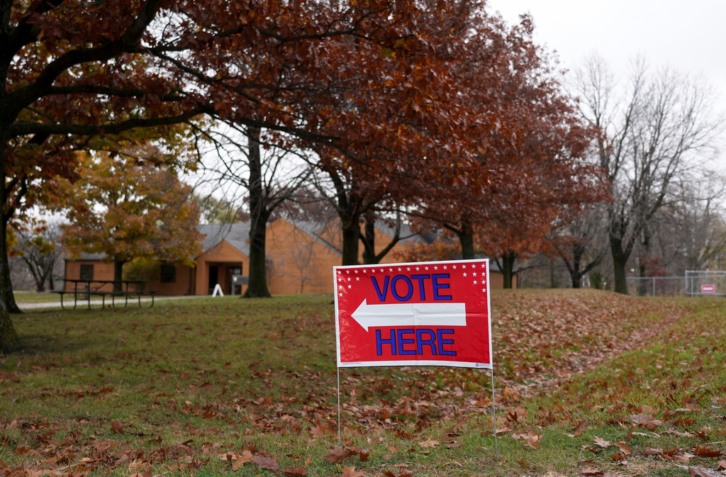 FILE - A "Vote Here" sign is seen on Election Day on Nov. 5, 2024, at Perfect Games in Ames, Iowa. (AP Photo/Bryon Houlgrave, File)