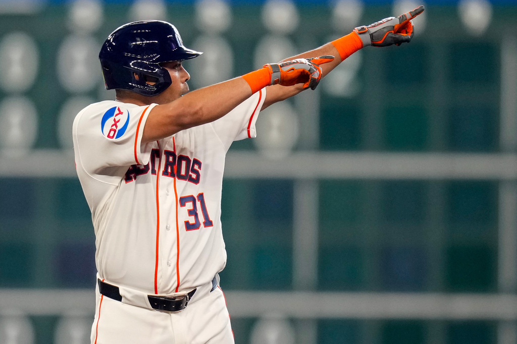 Houston Astros' LaMonte Wade Jr. reacts after hitting a two-run double against the Athletics during the fifth inning of a baseball game, Saturday, June 6, 2026, in Houston. (AP Photo/Eric Christian Smith)