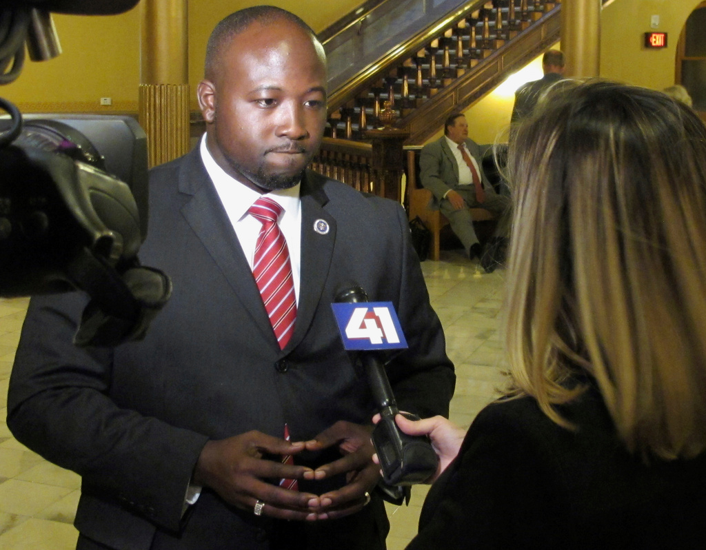 FILE - District Attorney Mark Dupree of Wyandotte County, Kan., answers a television reporter's questions following a Kansas House committee hearing, Tuesday, May 16, 2017, at the Statehouse in Topeka, Kan. (AP Photo/John Hanna, File)