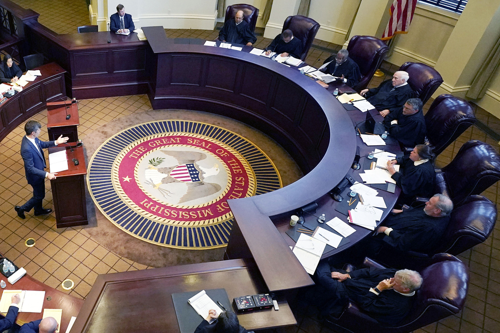 FILE - Mississippi Supreme Court justices, right, listen to arguments in Jackson, Miss., July 6, 2023. (AP Photo/Rogelio V. Solis, File)