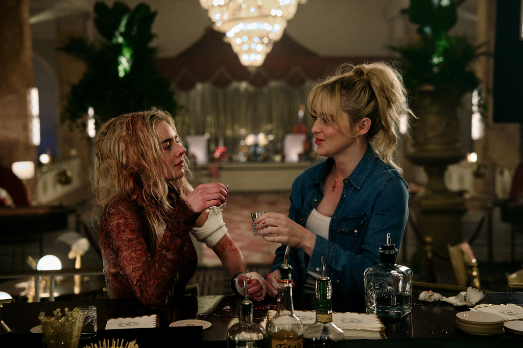 This image released by Searchlight Pictures shows Samara Weaving, left, and Kathryn Newton in a scene from "Ready or Not 2: Here I Come." (Pief Weyman/Searchlight Pictures via AP)