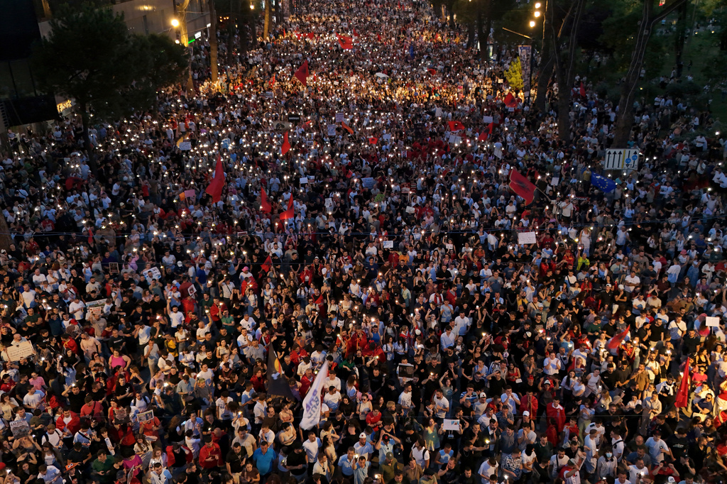 Protesters take part in a rally in Tirana, Albania, Tuesday, June 9, 2026, against the construction of a massive coastal development project linked to Jared Kushner and Ivanka Trump at Narta lagoon area, western Albania. (AP Photo/Hameraldi Agolli)