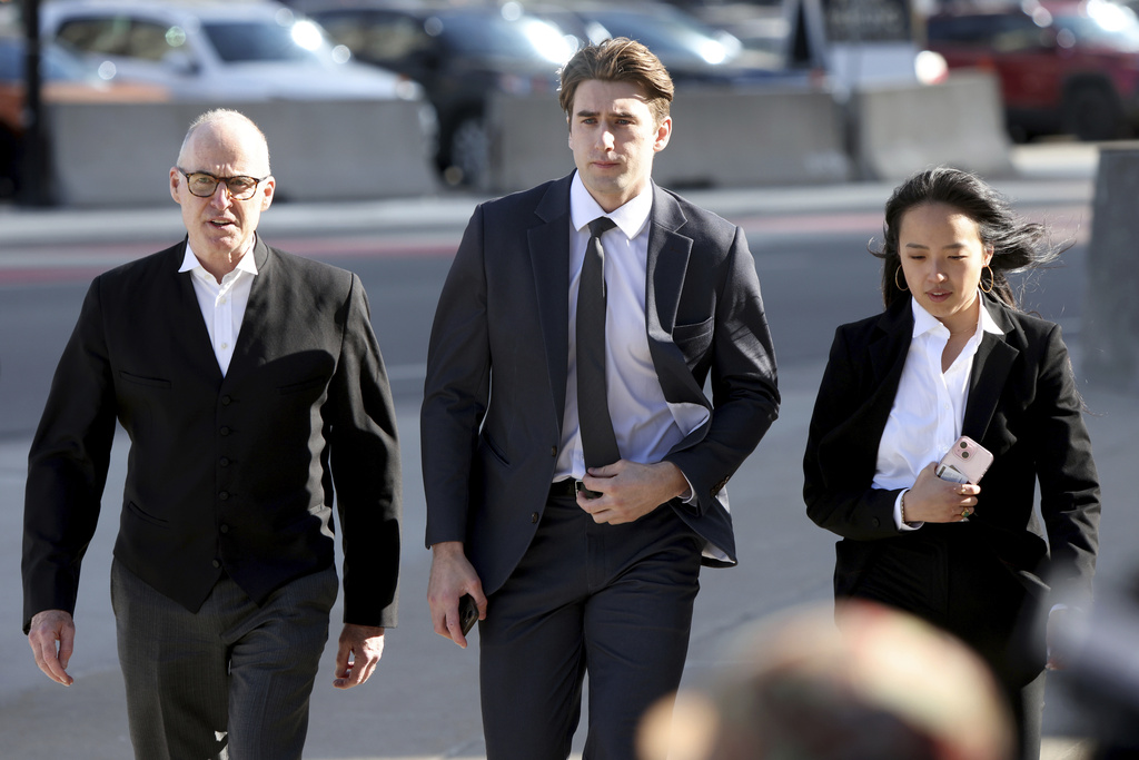 FILE - Hockey player Michael McLeod, center, arrives at the London Courthouse in London, Ontario, Canada, Tuesday, April 22, 2025. (Nicole Osborne/The Canadian Press via AP, File)