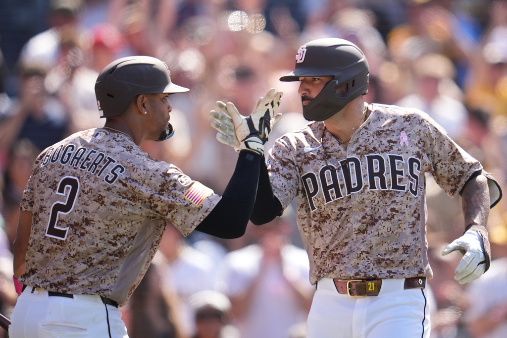 San Diego Padres' Nick Castellanos, right, celebrates his two-run home run with teammate Xander Bogaerts (2) during the ninth inning of a baseball game against the St. Louis Cardinals Sunday, May 10, 2026, in San Diego. (AP Photo/Gregory Bull)
