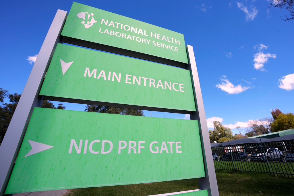 Signs at the headquarters of South Africa's National Institute for Communicable Diseases, in Johannesburg, South Africa, Wednesday, May 6, 2026. (AP Photo/Themba Hadebe)
