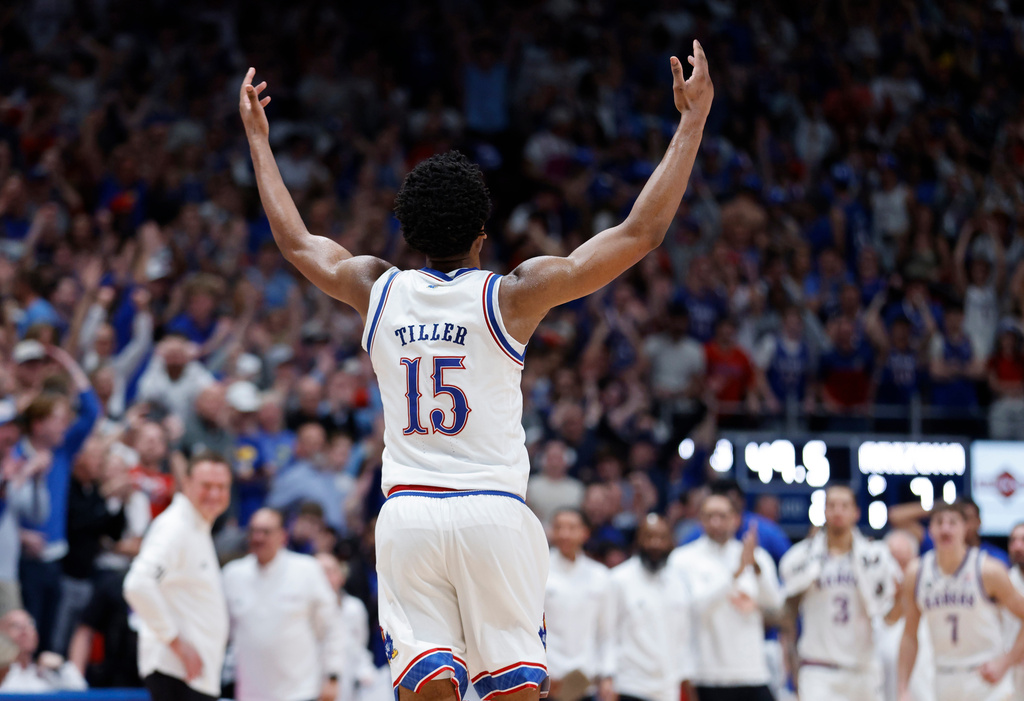 Kansas forward Bryson Tiller reacts after blocking a shot by Arizona during the second half of an NCAA college basketball game, Monday, Feb. 9, 2026, in Lawrence, Kan. (AP Photo/Colin E. Braley)