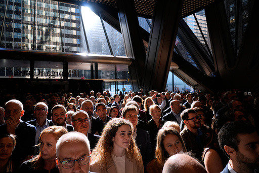 JPMorgan Chase employees and supporters listen to speeches in the lobby of the new building during a ribbon cutting ceremony in New York, Tuesday, Oct. 21, 2025. (AP Photo/Seth Wenig) JPMorgan Chase employees and supporters listen to speeches in the lobby of the new building during a ribbon cutting ceremony in New York, Tuesday, Oct. 21, 2025. (AP Photo/Seth Wenig)