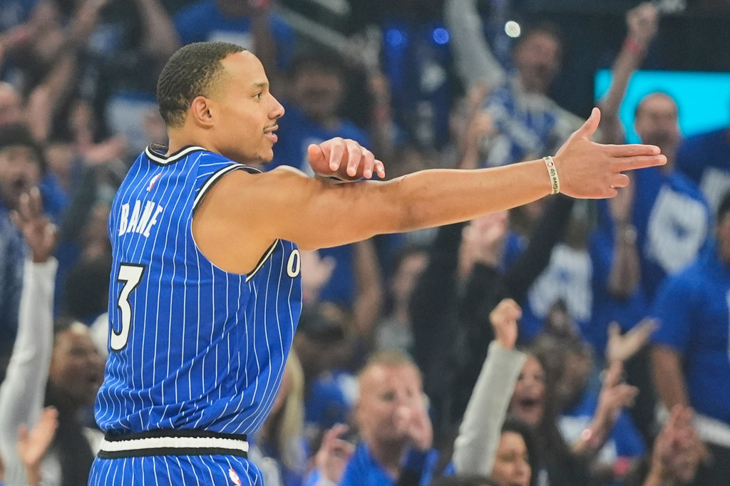 Orlando Magic guard Desmond Bane (3) points to teammates after sinking a 3-point shot against the Detroit Pistons during the first half in Game 4 of a first-round NBA basketball playoff series, Monday, April 27, 2026, in Orlando, Fla. (AP Photo/John Raoux)
