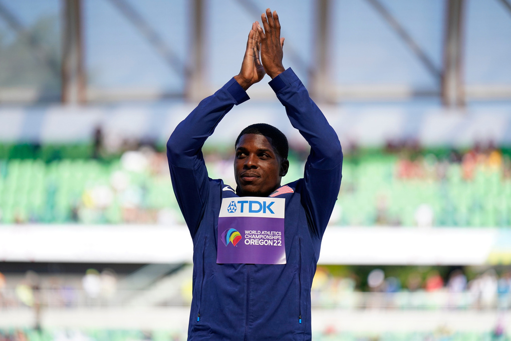 FILE - Silver medalist Marvin Bracy, of the United States, stands on the podium after the final in the men's 100-meter run at the World Athletics Championships, July 17, 2022, in Eugene, Ore. (AP Photo/Ashley Landis, File)