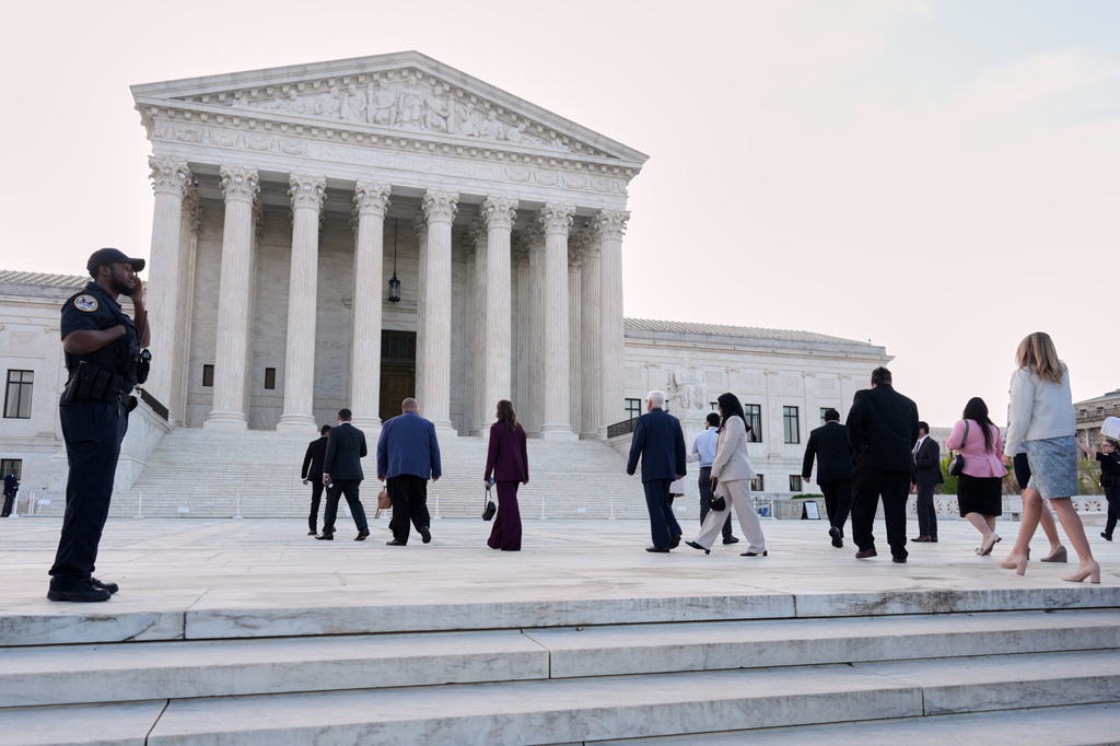 People arrive to walk inside the U.S. Supreme Court, on Capitol Hill in Washington, Wednesday, April 1, 2026. The Supreme Court justices will hear oral arguments today on whether President Donald Trump can deny citizenship to children born to parents who are in the United States illegally or temporarily. (AP Photo/J. Scott Applewhite)