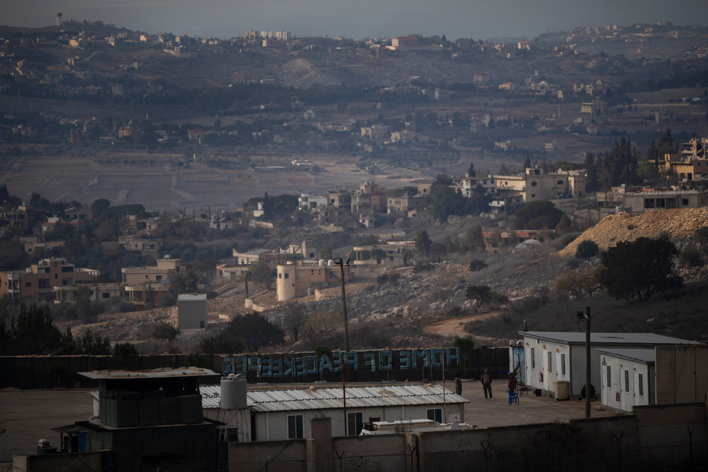 FILE - UN soldiers stand at a base of the United Nations peacekeeping forces in Lebanon (UNIFIL) at the Israeli-Lebanese border, as seen from the Kibbutz Manara, northern Israel, on Nov. 28, 2024. (AP Photo/Leo Correa, File)