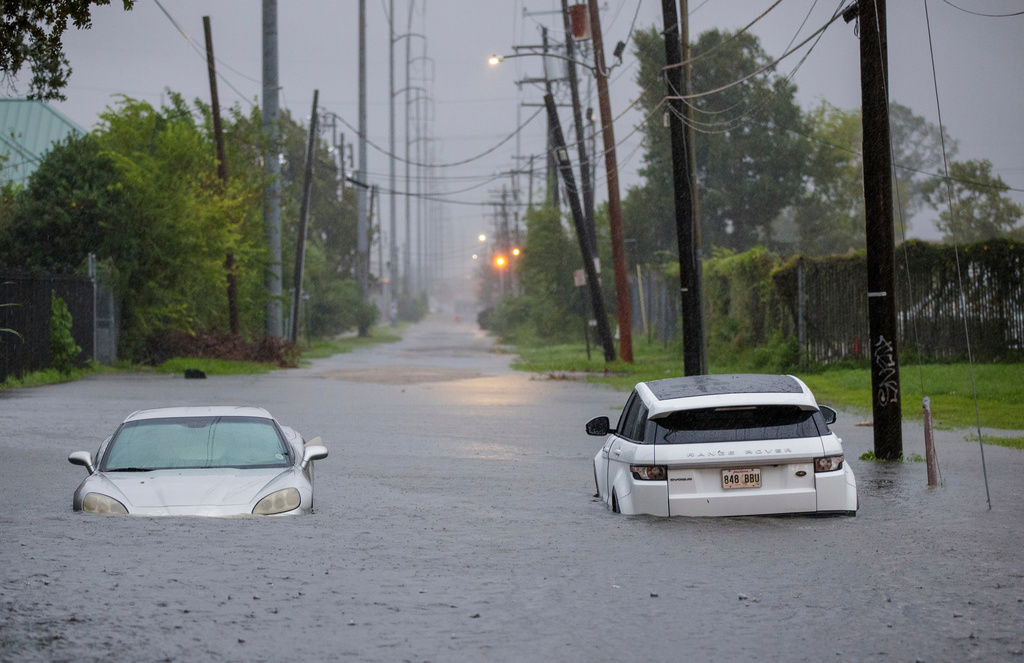 FILE - Two vehicle on Olive Street are flooded during Hurricane Francine in New Orleans, Sept. 11, 2024. (David Grunfeld/The Times-Picayune via AP, File)