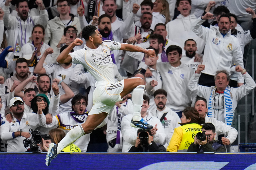 Real Madrid's Jude Bellingham celebrates after scoring the opening goal during the Spanish La Liga soccer match between Real Madrid and Sevilla in Madrid, Spain, Saturday, Dec. 20, 2025. (AP Photo/Manu Fernandez)