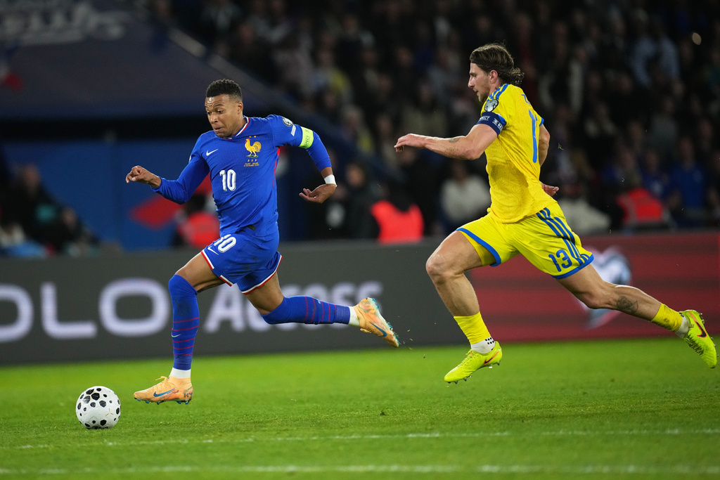 France's Kylian Mbappe scores his side's third goal during a World Cup 2026 group D qualifying soccer match between France and Ukraine in Paris, Thursday, Nov. 13, 2025. (AP Photo/Christophe Ena)