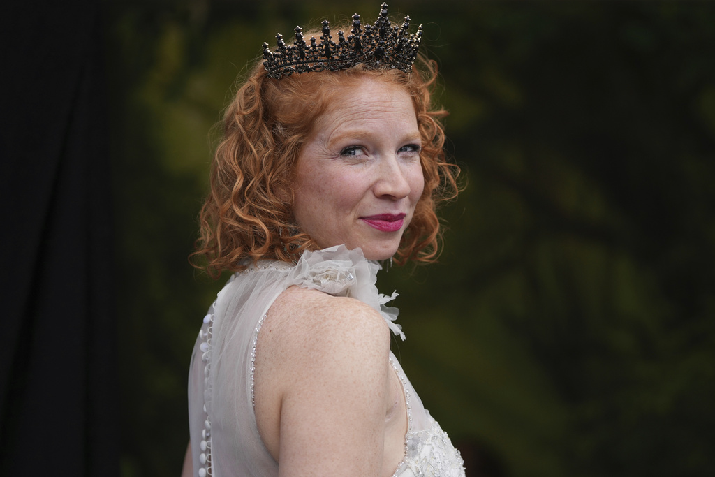 A participant poses with a crown during the Red Head Days festival in Tilburg, Netherlands, Saturday, Aug. 30, 2025. (AP Photo/Virginia Mayo)