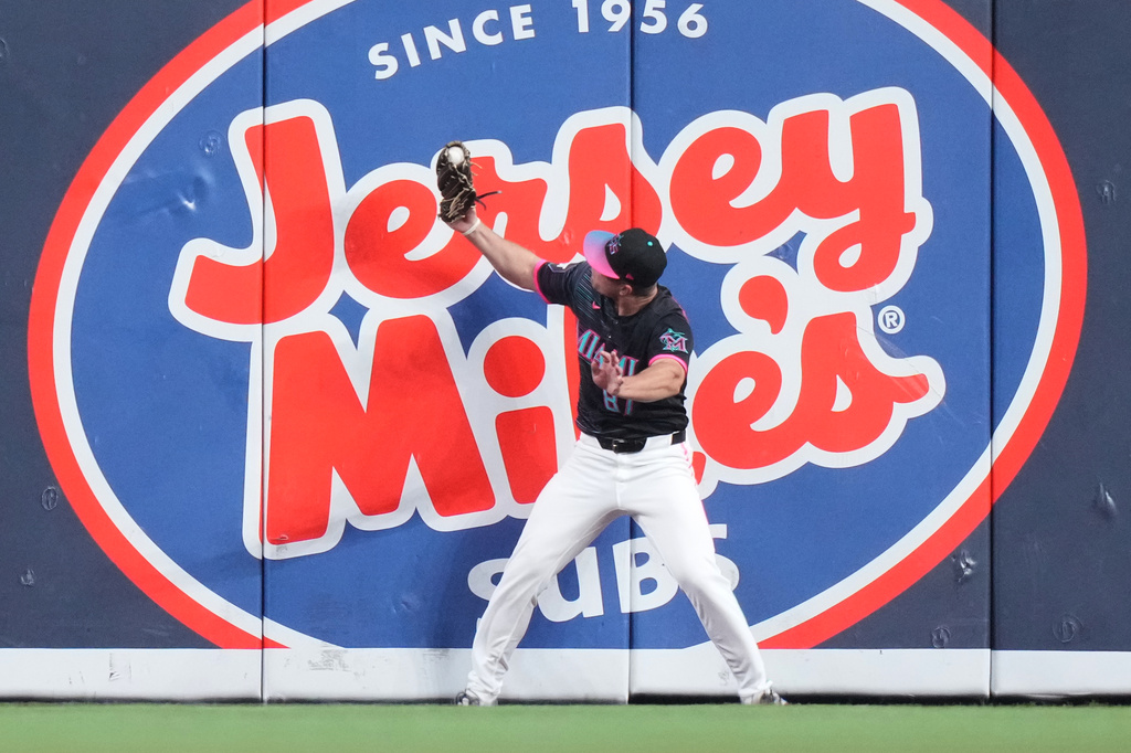 Miami Marlins center fielder Jakob Marsee catches a fly ball hit by New York Mets' Carson Benge during the first inning of a baseball game, Friday, May 22, 2026, in Miami. (AP Photo/Lynne Sladky)