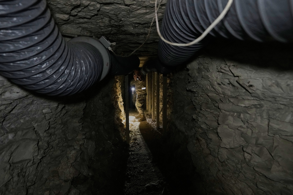 FILE - Lebanese army soldiers walk through a tunnel dug into a mountain that was used by Hezbollah militants as a clinic and storage facility near the Lebanese-Israeli border in the Zibqin Valley, southern Lebanon, Nov. 28, 2025. (AP Photo/Bilal Hussein, File)
