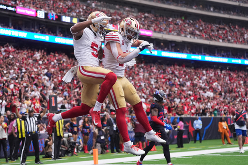 San Francisco 49ers wide receiver Demarcus Robinson (5) is congratulated by teammate Kyle Juszczyk after scoring on a two-point conversion during the second half of an NFL football game against the Houston Texans Sunday, Oct. 26, 2025, in Houston. (AP Photo/Eric Gay) San Francisco 49ers wide receiver Demarcus Robinson (5) is congratulated by teammate Kyle Juszczyk after scoring on a two-point conversion during the second half of an NFL football game against the Houston Texans Sunday, Oct. 26, 2025, in Houston. (AP Photo/Eric Gay)