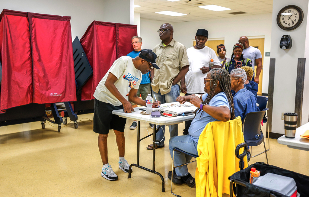 Voters line up to sign in and cast their ballots at the Dryades YMCA polling location in New Orleans, Saturday, May 16, 2026. (Sophia Germer/The Times-Picayune/The New Orleans Advocate via AP)
