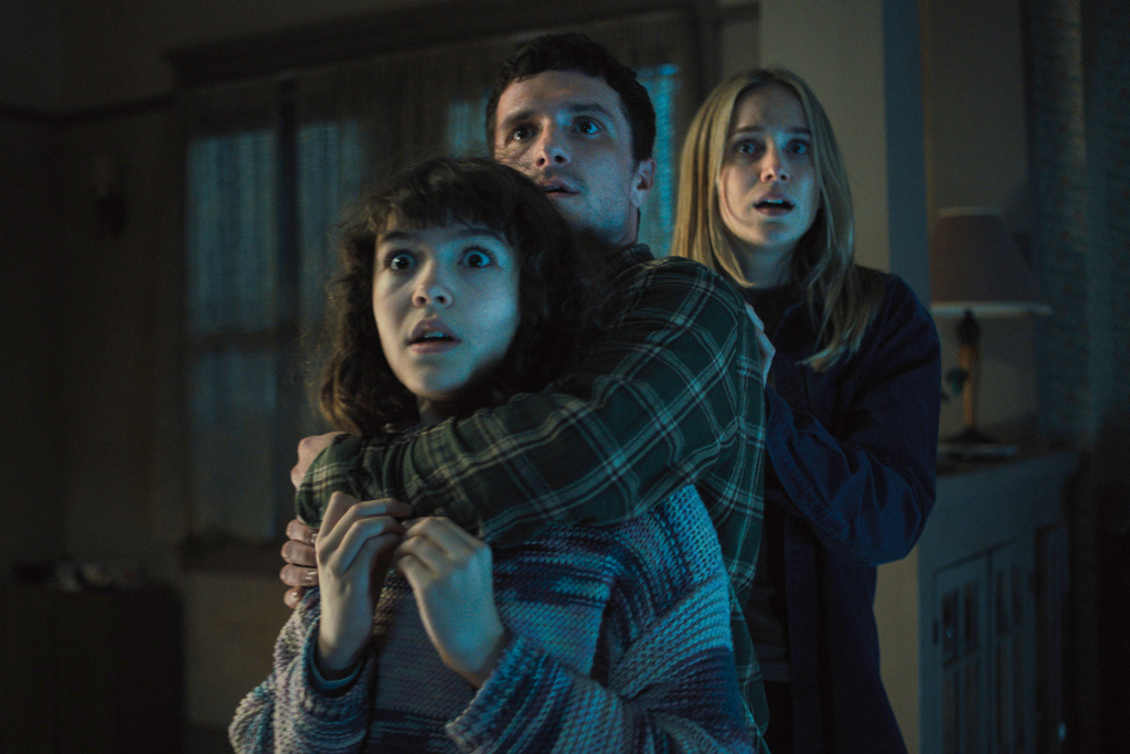 This image released by Universal Pictures shows Piper Rubio, from left, Josh Hutcherson and Elizabeth Lail, in a scene from "Five Nights at Freddy's 2." (Universal Pictures via AP)