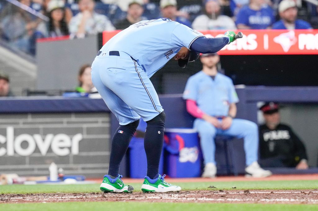 Toronto Blue Jays designated hitter George Springer (4) reacts after being struck out by Houston Astros pitcher Mike Burrows (50) during the sixth inning of a baseball game in Toronto on Wednesday, June 24, 2026. (Chris Young/The Canadian Press via AP)