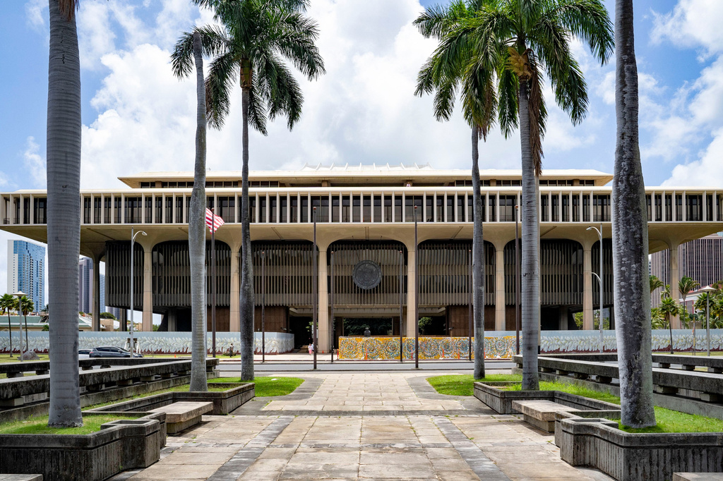 FILE - Palm trees frame the Hawaii State Capitol, April 23, 2025, in Honolulu, Hawaii. (AP Photo/Mengshin Lin, File)